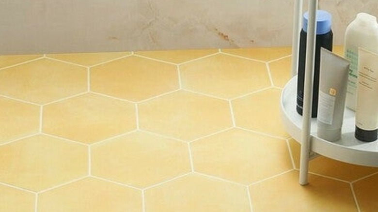 Sunflower yellow tiles in vintage bathroom