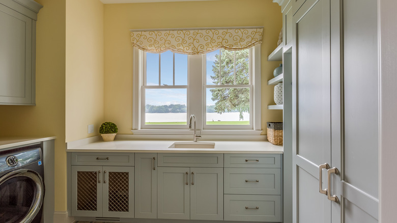 Yellow country style laundry room