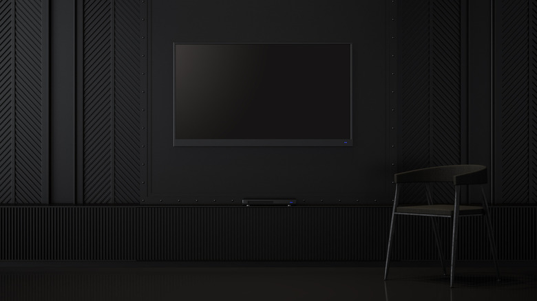 TV by a black wall