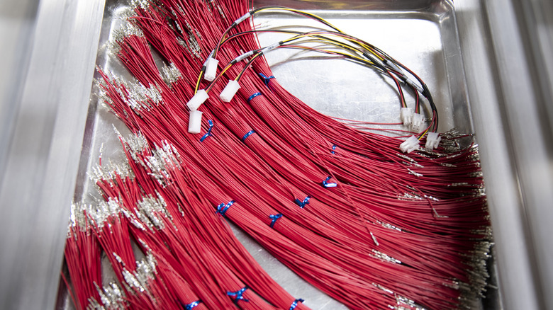 bundles of red cords organized in a drawer