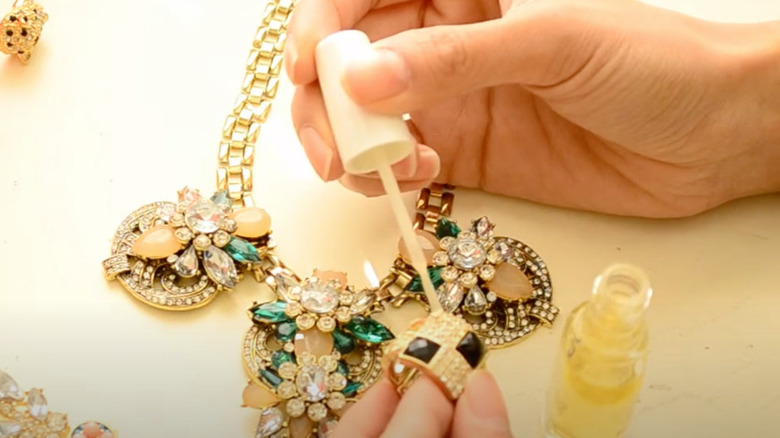 Using clear polish to seal fashion jewelry