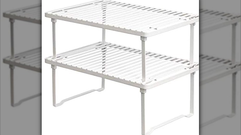 white cabinet rack with dishes