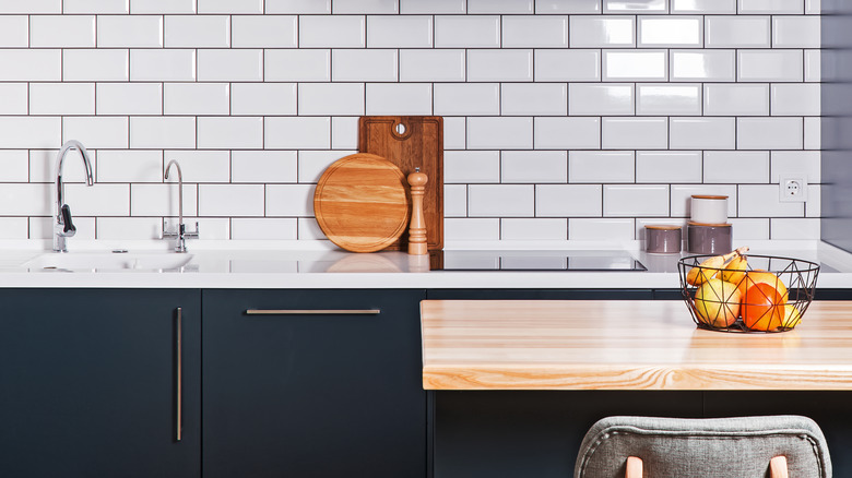 Navy cabinets and white countertops