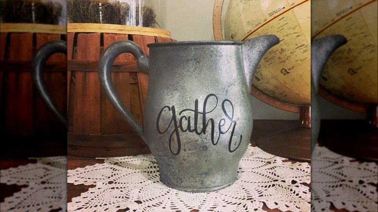 silver pitcher with "gather" text