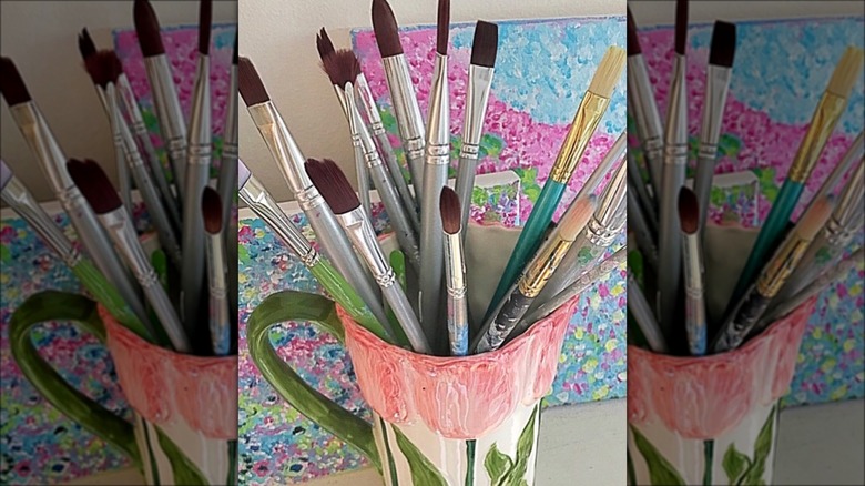 floral pitcher with paintbrushes