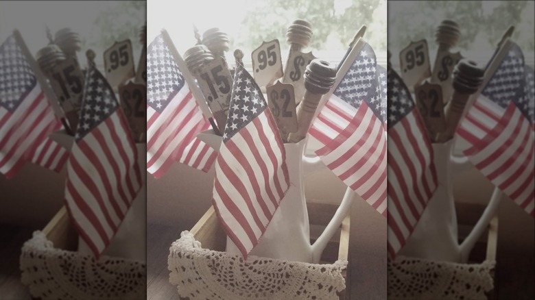 american flags in white pitcher