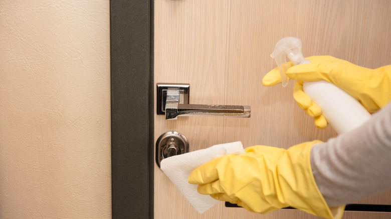 door knobs being sanitized