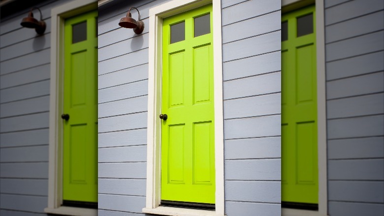 chartreuse door on gray building