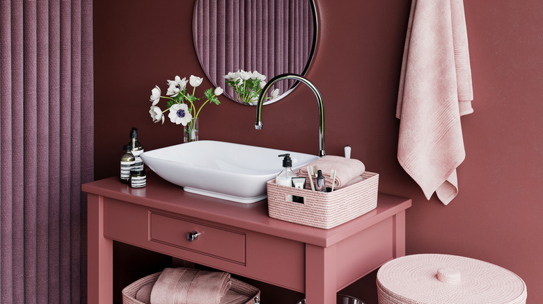 Pink bathroom with white sink