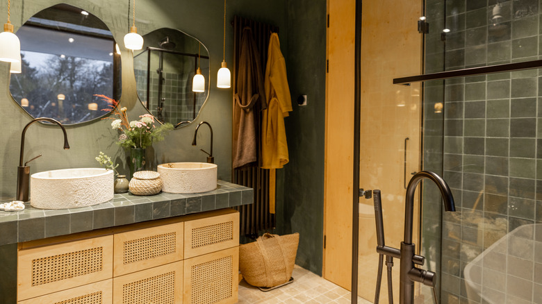 Green bathroom with wood accents