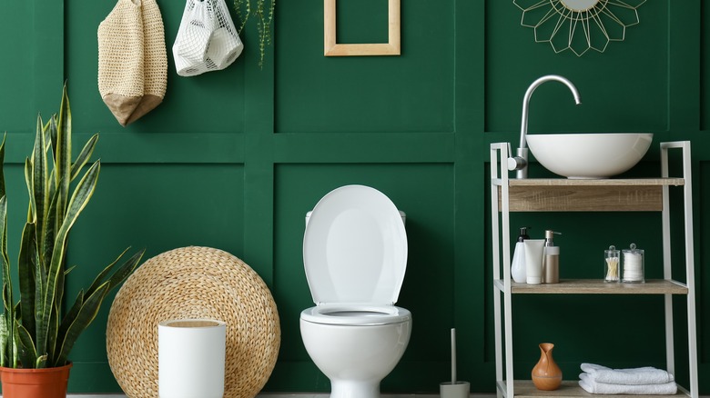 Green bathroom with plant