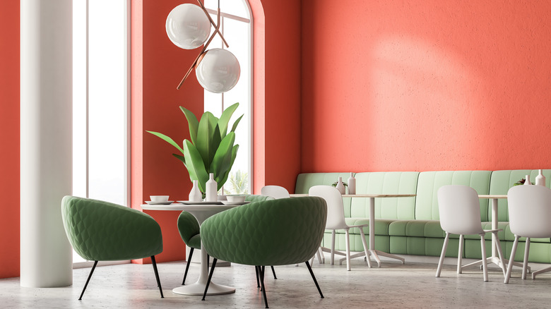 Grapefruit colored walls dining room