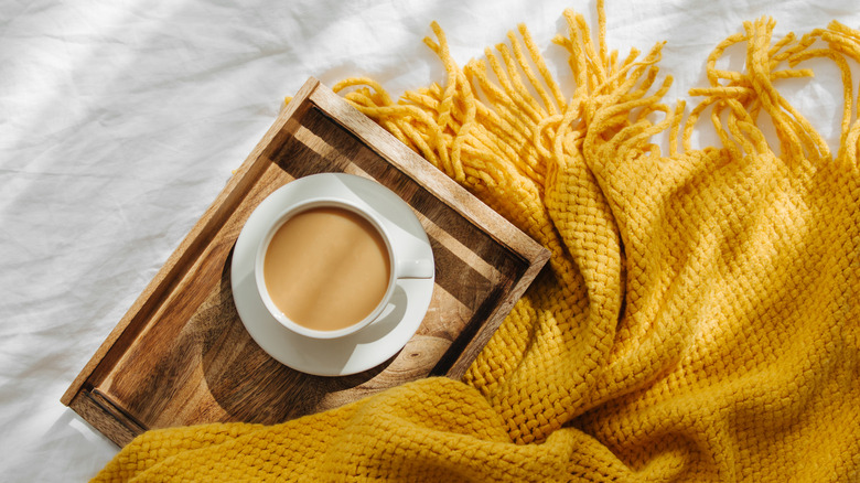 Bright yellow throw blanket and tea