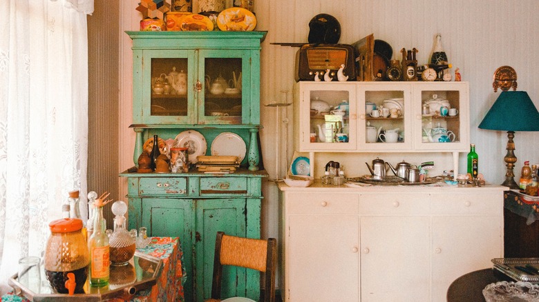 Teal cabinet dining room