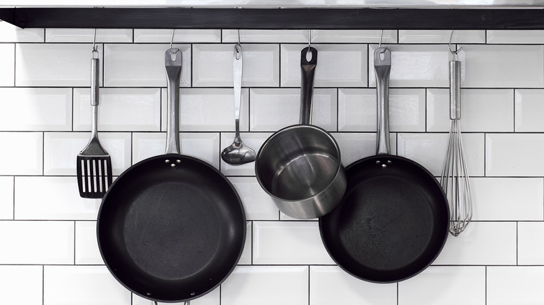 hanging pots and utensils in kitchen