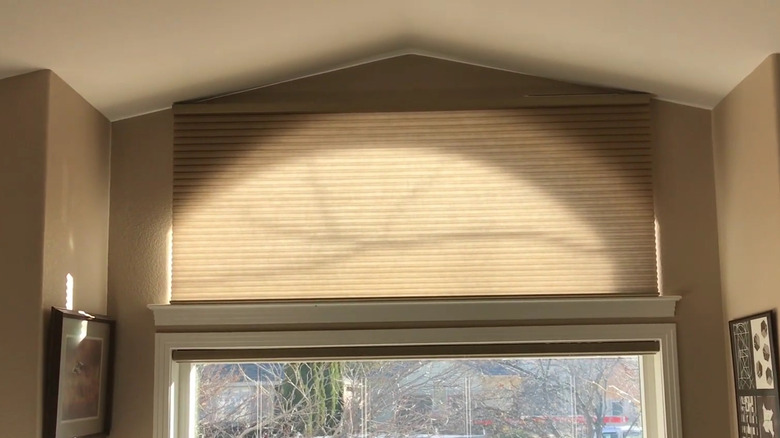 concertina blind over arched window