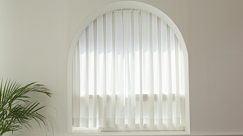 sheer voiles in arched window