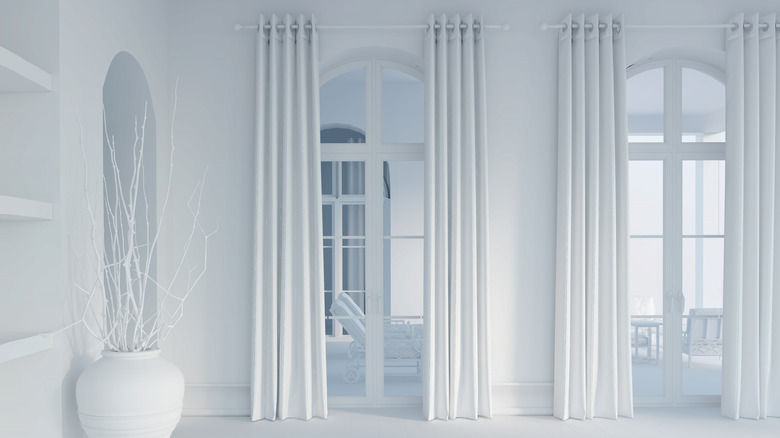 all white room with curtains