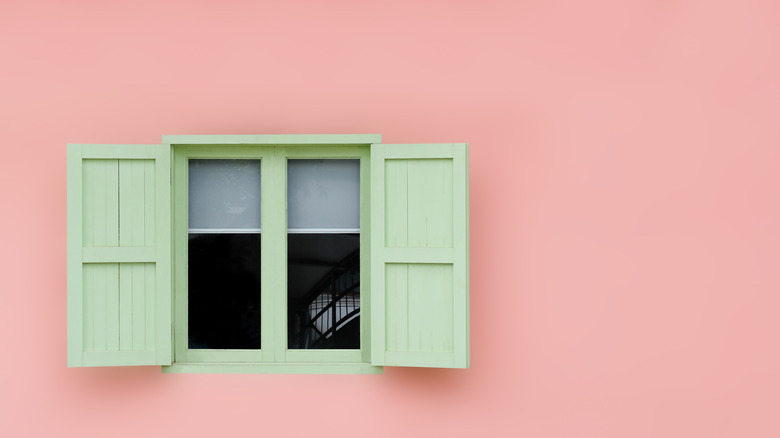 Green shutters on pink house