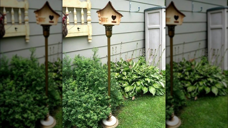 bird house on a floor lamp base