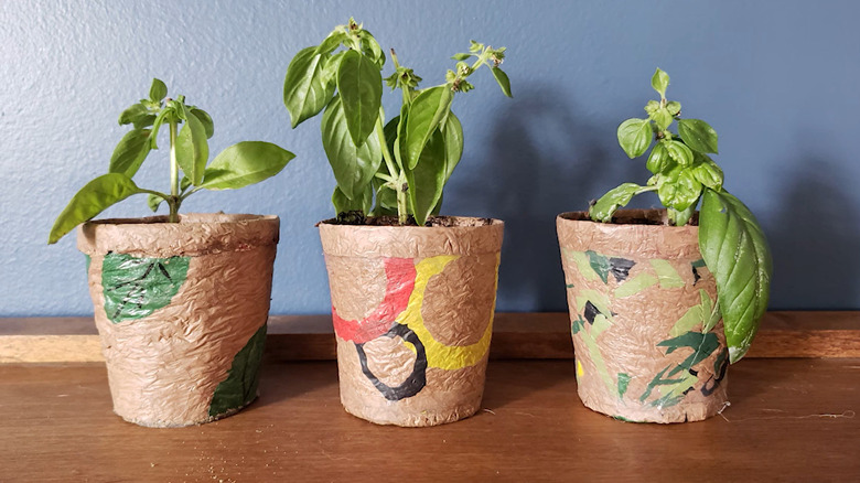 Potted plant covers made from fused plastic bags