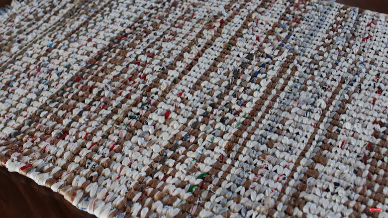 White and brown woven rug made from plastic bags