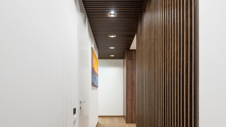 narrow corridor with wooden partitions