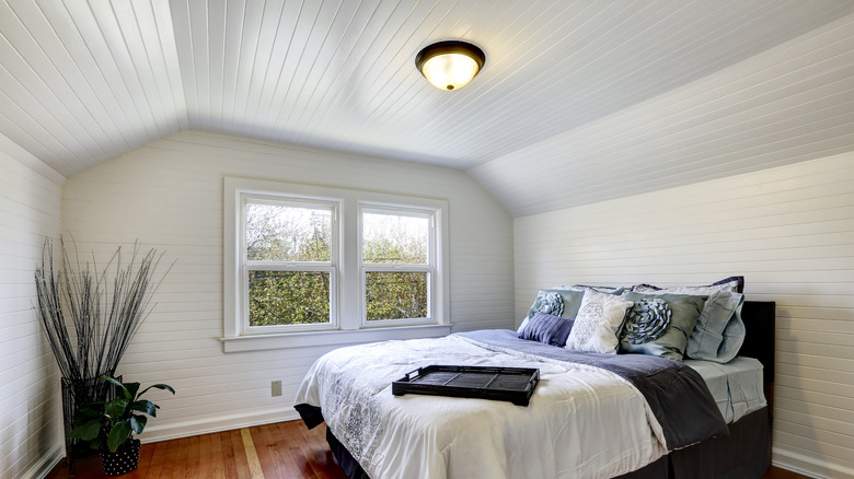 wood paneled walls and ceiling