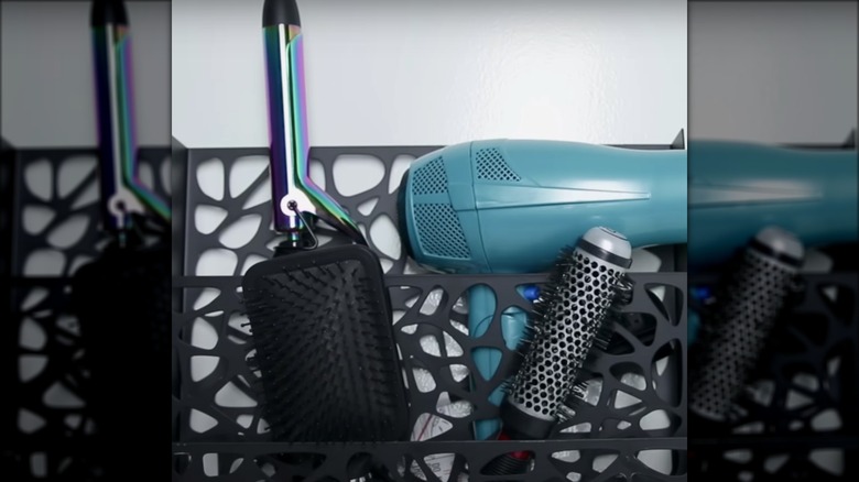 Heat styling tools in magazine holder