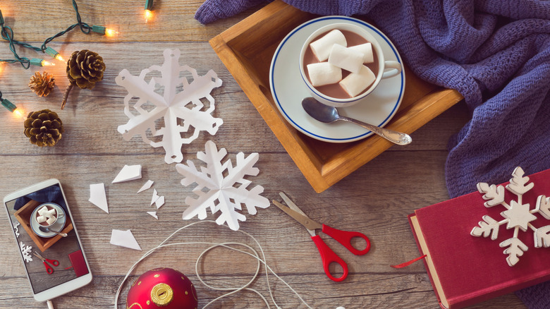 paper snowflakes with wooden background