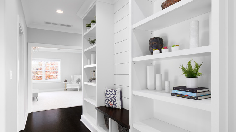 white hallway with reading nook