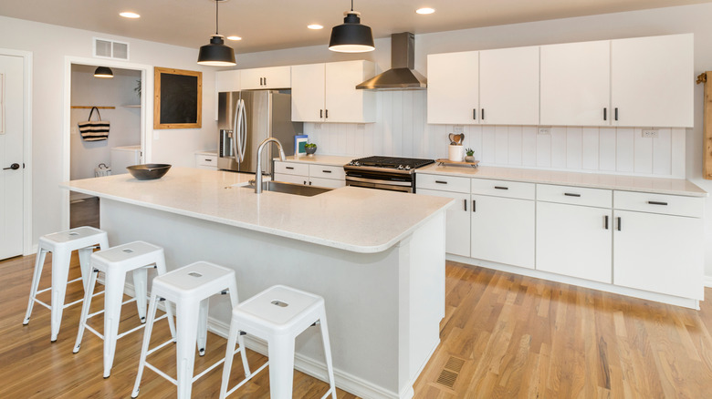 white kitchen with shiplap backsplash