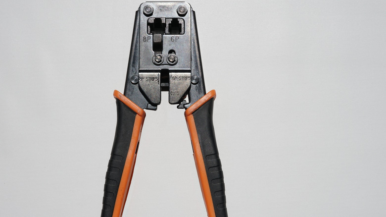 crimping pliers against gray background