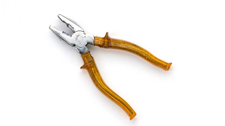 linesman pliers set against white background