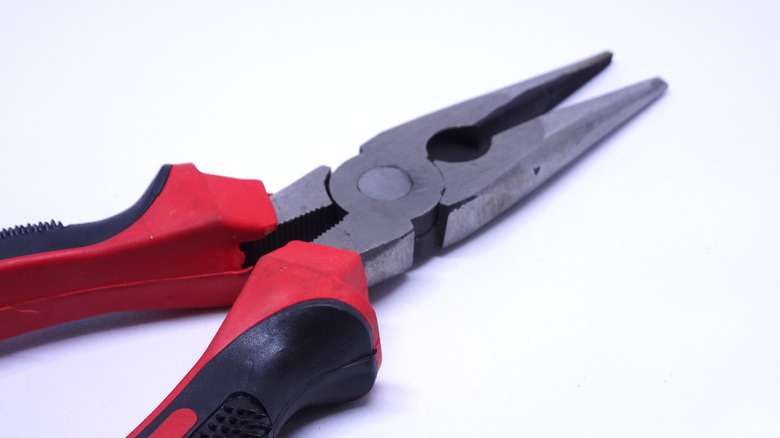 needle nose pliers against white background