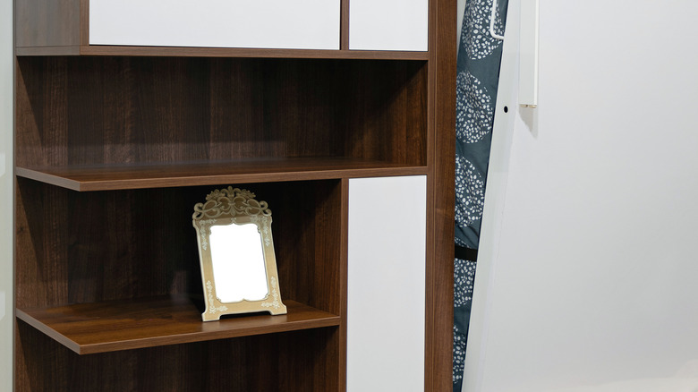 a murphy bed with shelves 