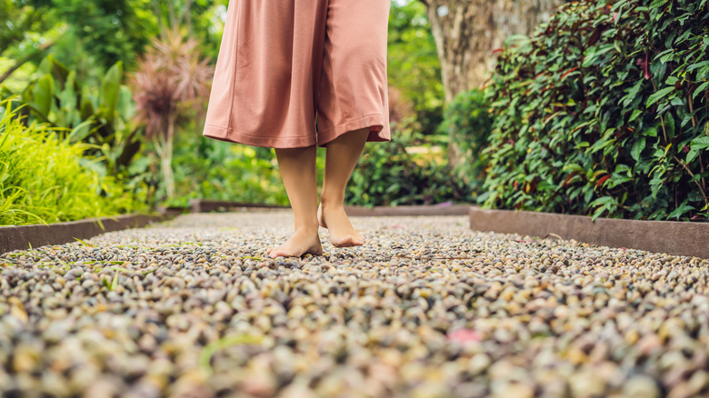 Woman walking on stone path