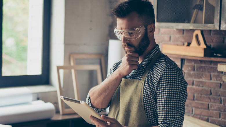 A woodworker thinking