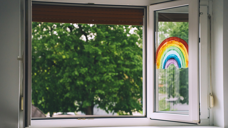 Window overlooking a green backyard