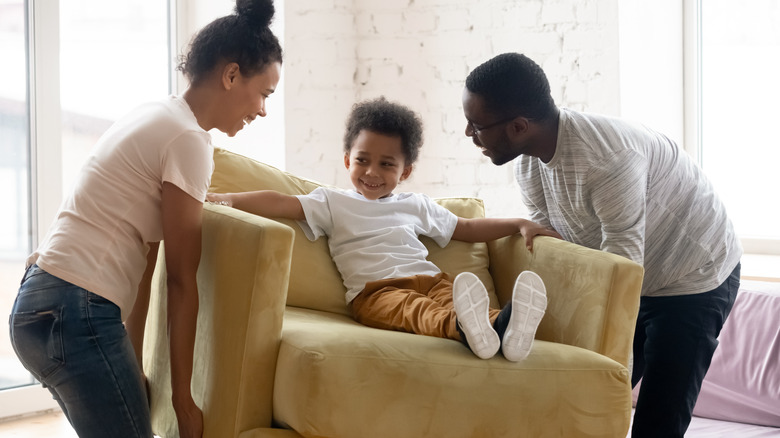 family moving yellow couch