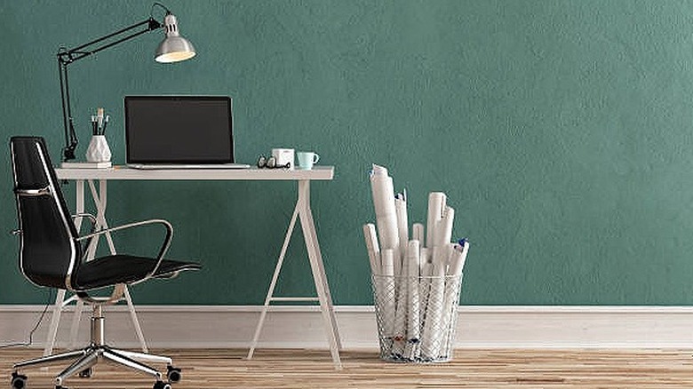 Teal wall with desk