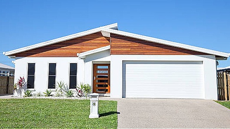 White garage with wood accents