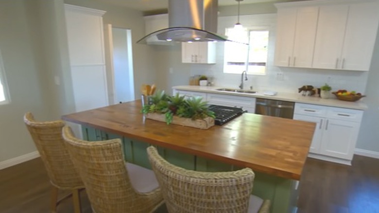 Modern kitchen with green island