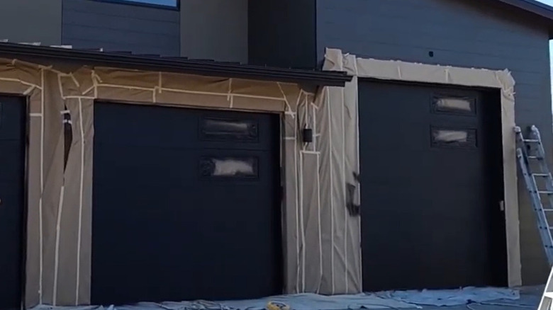 newly painted black garage doors