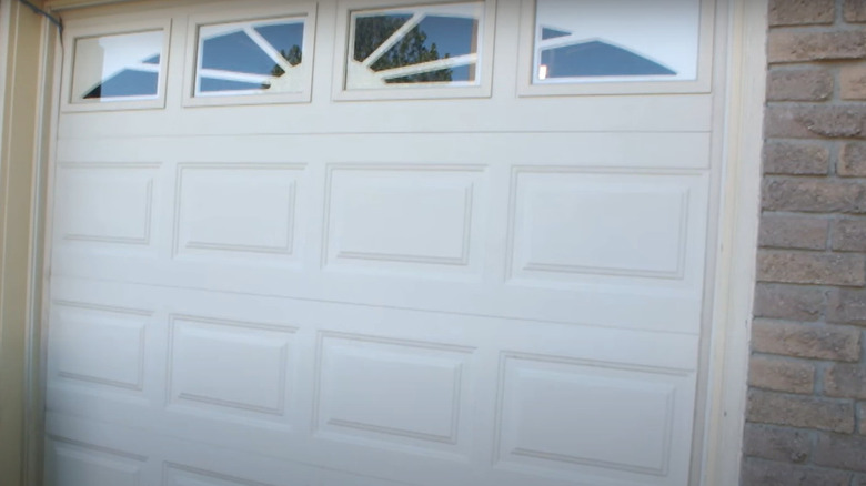 Beige garage door with windows