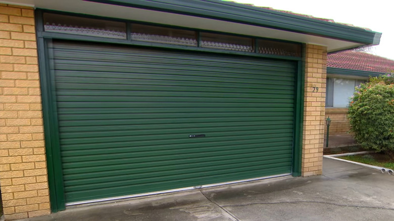 Green metal manual garage door