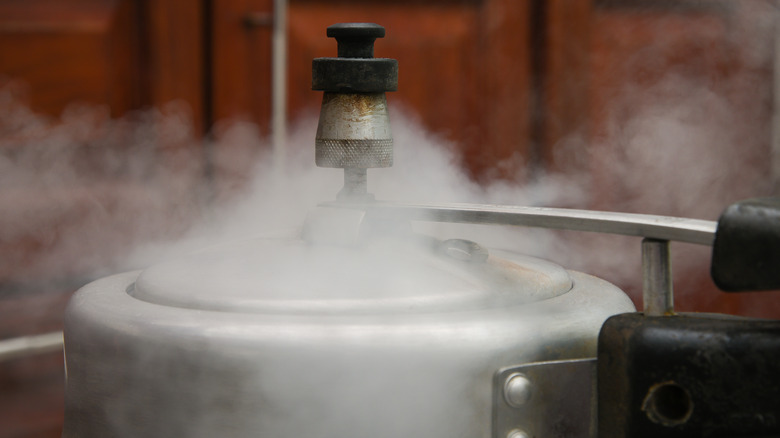 Steam from a pressure cooker