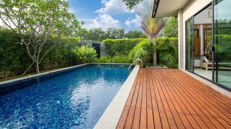 Pool and deck in backyard