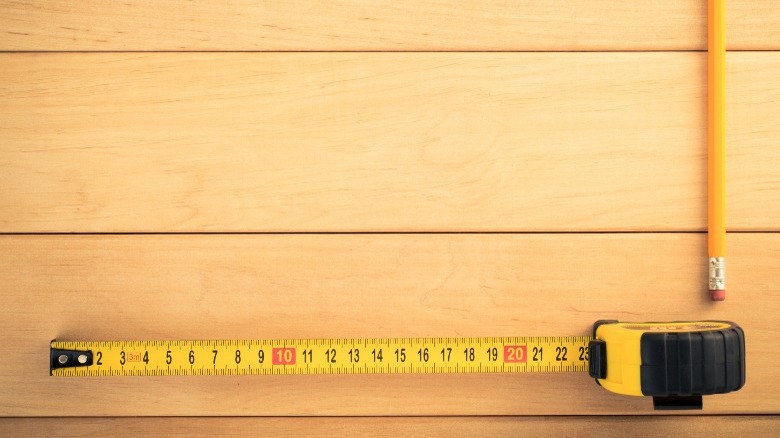 Tape measure on wood floor