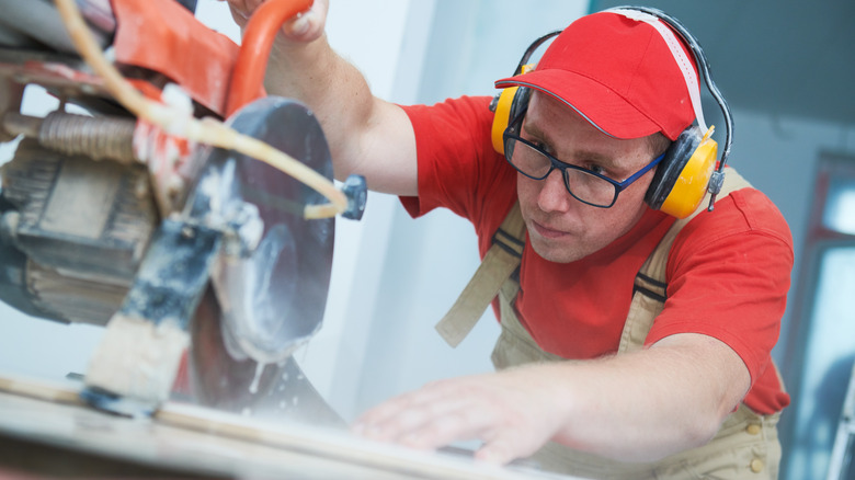 Person using a wet saw